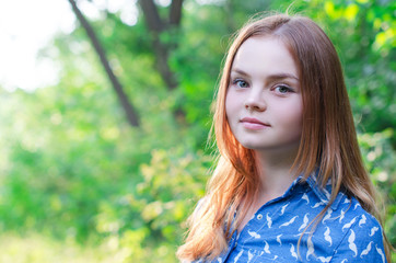 Naklejka premium Cute red hair girl teenager at nature