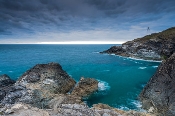 Lighthouse in Cornwall on rocky cliffs