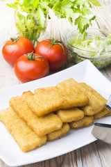 Meat croquettes served with fresh vegetables.