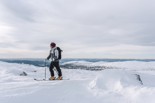 Skier skiing at sunny day