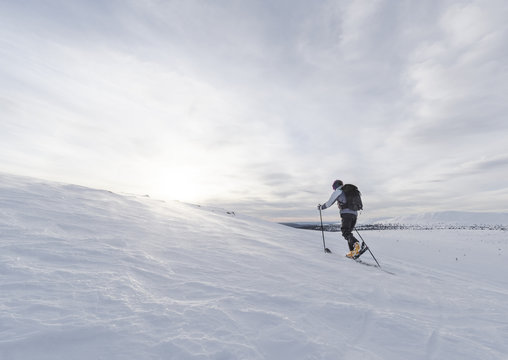 Skier skiing at sunny day