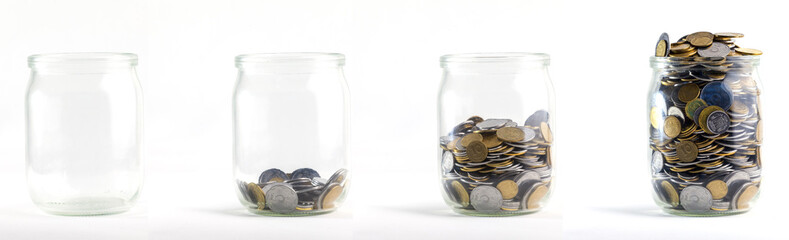 Glass jars with coins like diagram, isolated - savings concept