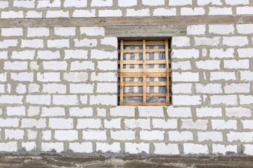 window in a new brick house