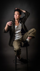 Androgynous character on a gray background. Man or woman. Military style. Very sharp.  