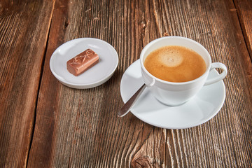 Chocolate bar on a brown wooden table