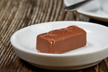 Chocolate bar on a brown wooden table