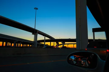 Fotobehang Sunset in Highway with bridges in Houston © lunamarina