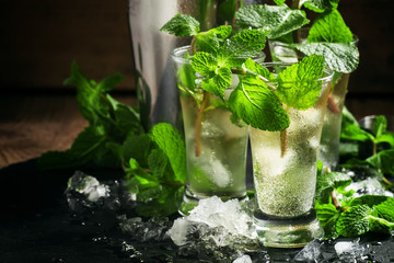 Alcoholic cocktail with vodka, mint tea, lemon juice, ice, sugar