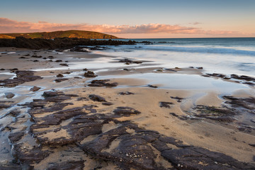 Red rocks on beach in Wembury, Devon, UK