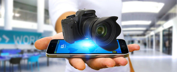 Young man using modern camera