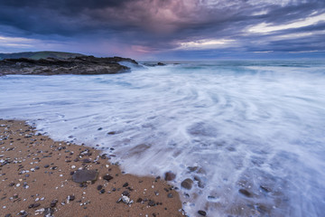 Vibrant and saturated long exposure sunset at beach