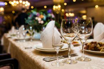Empty glasses in restaurant. Table setting for celebration
