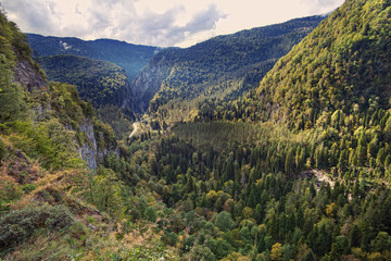 Obraz premium mountains valley in summer afternoon with gentle clouds