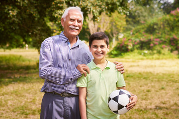 Portrait Happy Grandfather And Boy Grandson With Soccer Ball