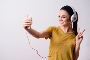 Cheerful girl listening to music
