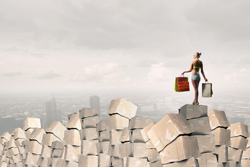 Girl on pile of boxes