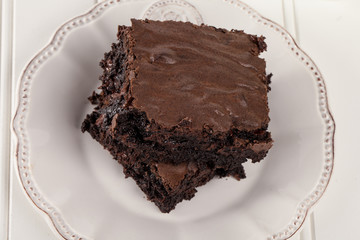Decadent dark chocolate chip brownie on white