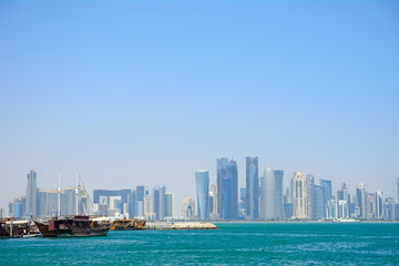 Naklejka premium Dhows in front of the skyscrapers of New Doha, Qatar