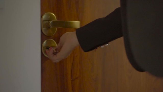 Business Woman Coming Home From Work Opening The Door With The Key