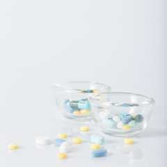 Fototapeta na wymiar Tablets pills heap color mix therapy drugs doctor flu antibiotic