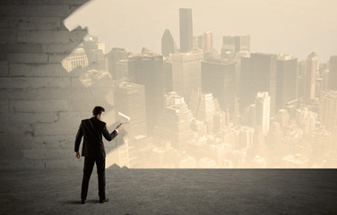 Salesman painting city scape on wall