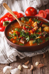 Homemade Hungarian Goulash soup bogracs close-up. Vertical
