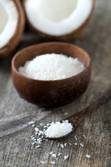 grated coconut on wooden surface