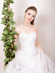 Beautiful bride with fashion wedding hairstyle. Close-up portrait of young gorgeous bride. Wedding