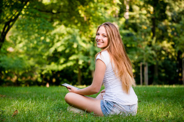 Teen girl with book reader