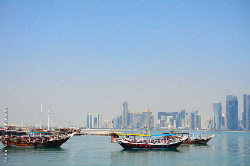 Wall mural Dhows in front of the skyscrapers of New Doha, Qatar