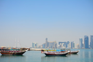 Dhows in front of the skyscrapers of New Doha, Qatar