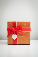 Gift box with a red bow.