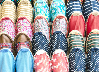 Colorful textile fabric slippers background