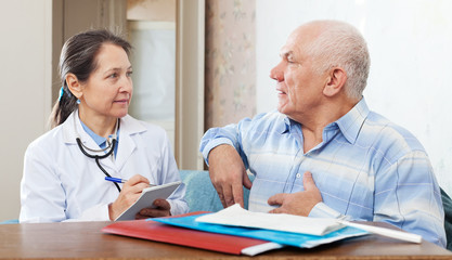 Senior man complaining to doctor