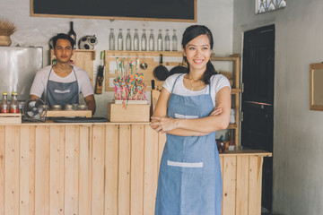 cafe owner standing with crossed arms