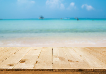 image of wooden table in front of Summer sea in Thailand