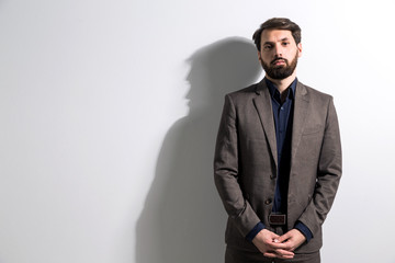 Crossed hands white wall