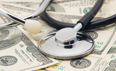 heap of dollars with stethoscope