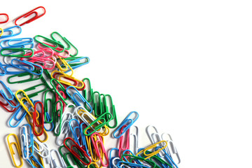a lot of colored paper clips on