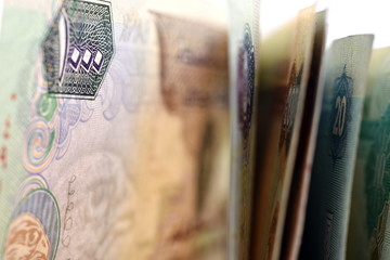 Close up different Dirhams currency note and coins, United Arab Emirates