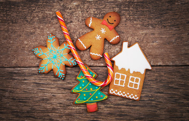 Gingerbread cookies over wooden background