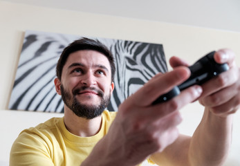 Bearded gamer with controller