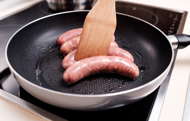 Sausages cooking
