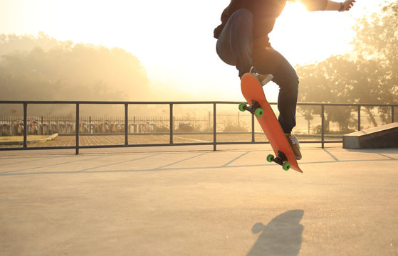 skateboarding woman at sunrise skatepark