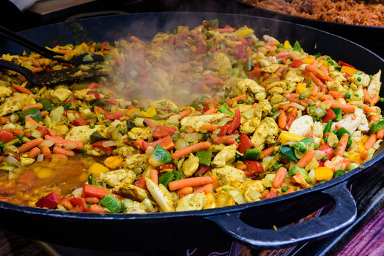 Stewed vegetables with meat in a large pan.