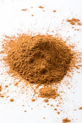 cinnamon powder on white table