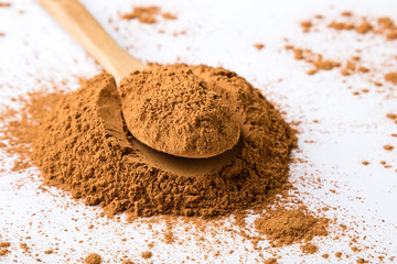 cinnamon powder on white table