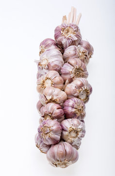 String of garlic isolated on white background