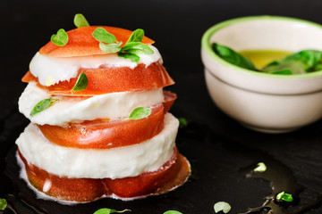 creative italian caprese over slate