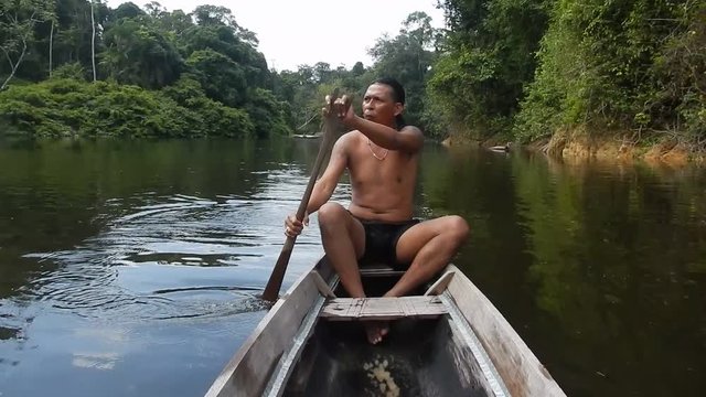 Arowak Indian paddling and whistling
